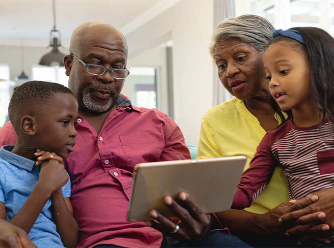 retired grandparents spending time with granddaughter