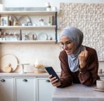 woman receiving good news from phone