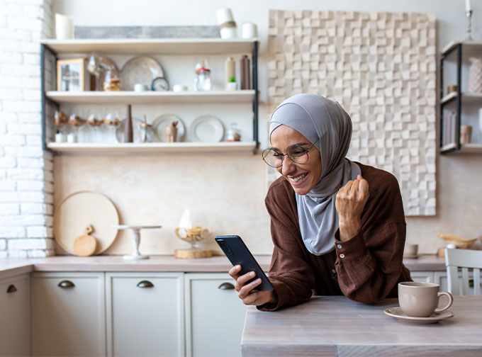 woman receiving good news from phone