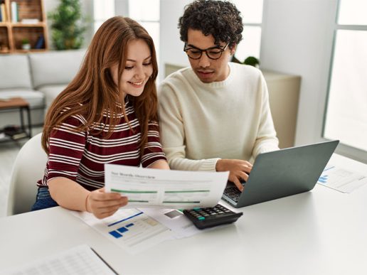 young couple reviewing savings